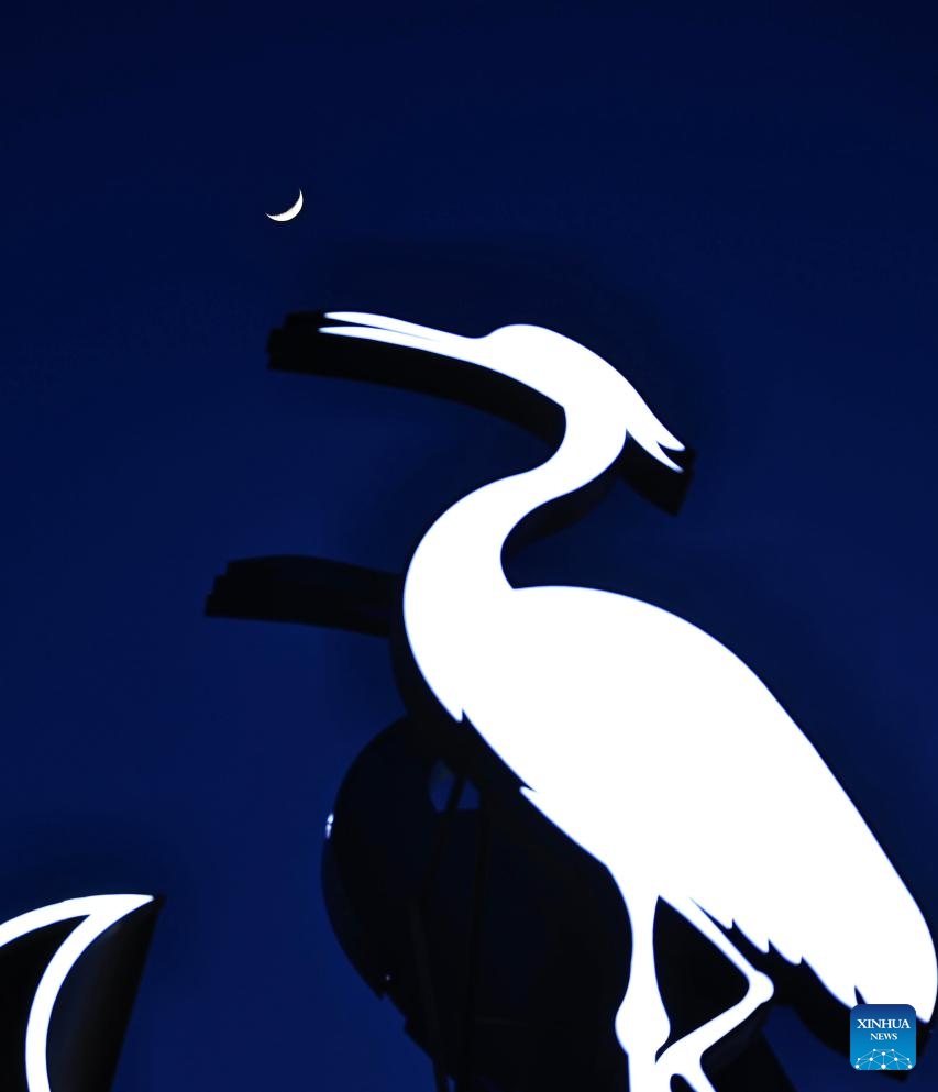 A waxing crescent moon is seen in the sky over Tongjiang, northeast China's Heilongjiang Province, April 21, 2026. (Photo by Liu Wanping/Xinhua)

