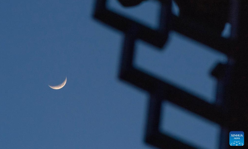 A waxing crescent moon is seen in the sky over Fujin, northeast China's Heilongjiang Province, April 21, 2026. (Photo by Qu Yubao/Xinhua)

