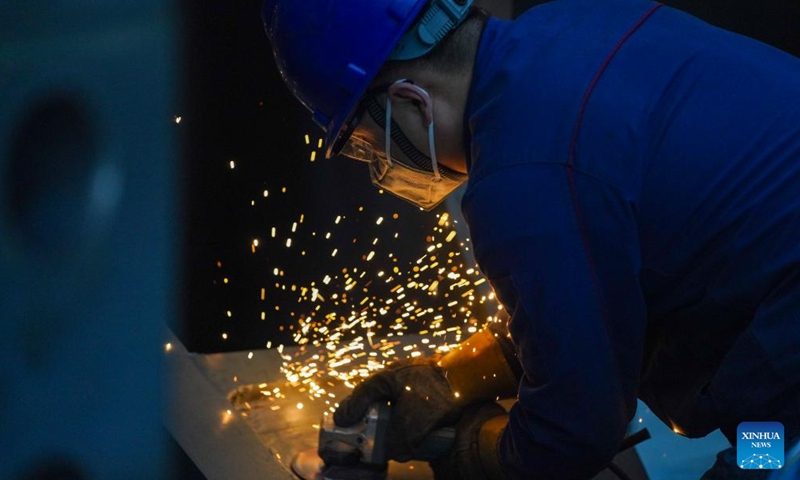 An employee works inside a workshop of Harbin Electric Machinery Company Limited in Harbin, northeast China's Heilongjiang Province, on April 21, 2026.
