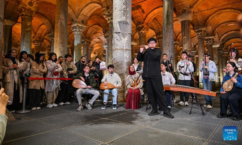 A member of Nanjing University's traditional instrument orchestra from China plays bamboo flute during a flash mob performance of Chinese folk music at Basilica Cistern in Istanbul, Türkiye, April 22, 2026. Nanjing University's traditional instrument orchestra, in collaboration with the Confucius Institute at Bogazici University, staged a flash mob performance of Chinese folk music here on Wednesday, attracting many visitors. (Xinhua/Liu Lei)

