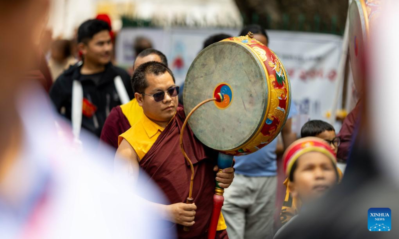 People take part in rituals during the Buddha Jayanti festival at Swayambhunath Stupa in Kathmandu, Nepal, May 1, 2026. Buddha Jayanti is a sacred festival commemorating the birth, attainment of enlightenment, and death of Buddha on the full moon day in the Nepali month of Baishakh each year. (Photo by Sulav Shrestha/Xinhua)