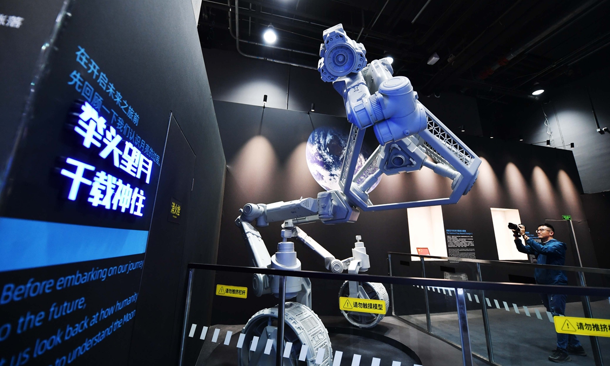 Ahead of the 11th China Space Day, a visitor explores the immersive space science exhibition, Footprints Among the Stars: Rendezvous with the Moon's Far Side, at the China Science and Technology Museum in Beijing on April 23, 2026. China's first exhibition themed on far-side lunar exploration, the exhibition opened earlier that day.  