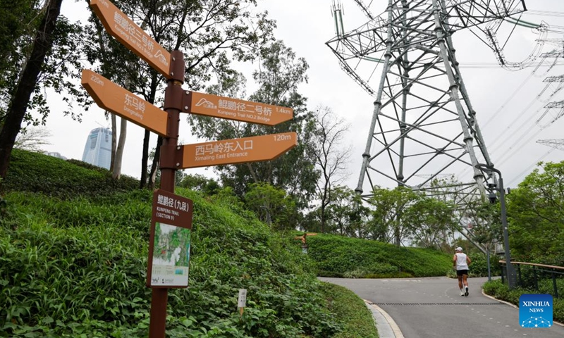 This photo taken on April 21, 2026 shows a sign board indicating Kunpeng Trail bridges in Shenzhen, south China's Guangdong Province. In recent years, Shenzhen has explored a distinctive path for biodiversity conservation in urban areas by developing ecological trails, building eco-friendly facilities and implementing refined ecological management. These efforts have reserved sufficient space for wildlife habitats and migration routes, creating dual trails to support the harmonious coexistence of humans and wildlife. (Xinhua/Liang Xu)

