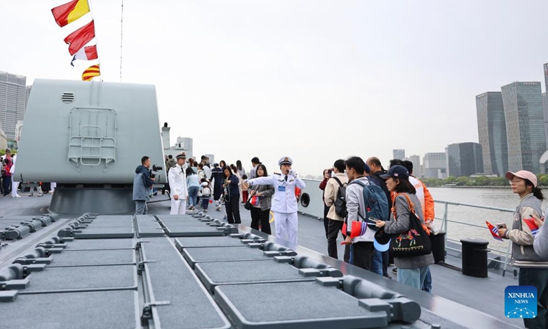 People visit Chinese People's Liberation Army (PLA) Navy ship Fuyang during an open-ship event in east China's Shanghai, April 21, 2026. The Chinese People's Liberation Army (PLA) Navy opened its barracks to the public in Shanghai on Tuesday, marking its 77th anniversary, with active-duty vessels set for public visits. (Xinhua/Fang Zhe)

