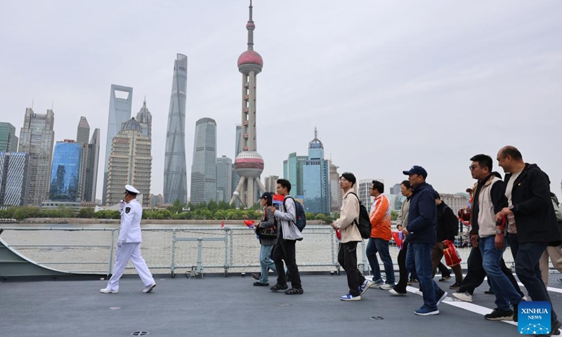 People visit Chinese People's Liberation Army (PLA) Navy ship Fuyang during an open-ship event in east China's Shanghai, April 21, 2026. The Chinese People's Liberation Army (PLA) Navy opened its barracks to the public in Shanghai on Tuesday, marking its 77th anniversary, with active-duty vessels set for public visits. (Xinhua/Fang Zhe)

