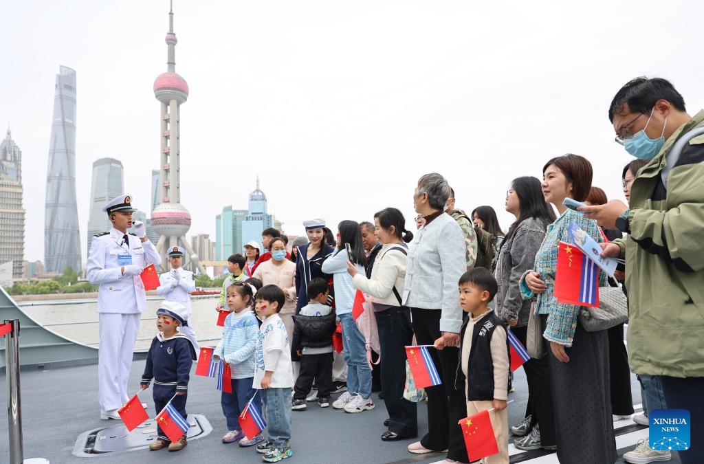 People visit Chinese People's Liberation Army (PLA) Navy ship Fuyang during an open-ship event in east China's Shanghai, April 21, 2026. The Chinese People's Liberation Army (PLA) Navy opened its barracks to the public in Shanghai on Tuesday, marking its 77th anniversary, with active-duty vessels set for public visits. (Xinhua/Fang Zhe)


