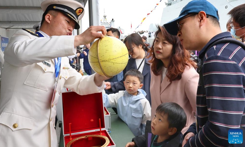 People attend an open-ship event in east China's Shanghai, April 21, 2026. The Chinese People's Liberation Army (PLA) Navy opened its barracks to the public in Shanghai on Tuesday, marking its 77th anniversary, with active-duty vessels set for public visits. (Xinhua/Fang Zhe)

