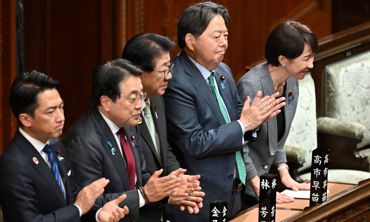 Japan's Prime Minister Sanae Takaichi (Right) and her cabinet ministers react after the government's bill to establish a national intelligence committee was passed by a majority vote of both ruling and opposition parties during a plenary session of the House of Representatives in Tokyo on Thursday April 23, 2026. Photo: VCG