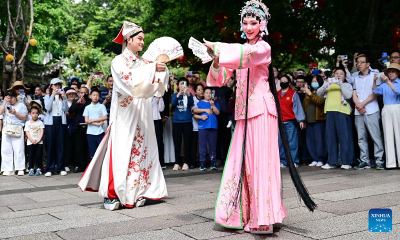 Actors of Minju Opera stage a flash mob performance in the Shangxiahang traditional block in Fuzhou, southeast China's Fujian Province, May 2, 2026. Local authorities have introduced a series of diverse programs and events that enable tourists to experience the charm of traditional culture and custom during the May Day holiday that started on May 1. (Xinhua/Lin Shanchuan)