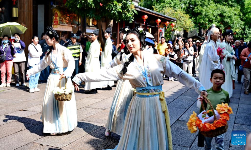 A flower goddess parade is held in the historic and cultural city block Three Lanes and Seven Alleys in Fuzhou, southeast China's Fujian Province, May 2, 2026. Local authorities have introduced a series of diverse programs and events that enable tourists to experience the charm of traditional culture and custom during the May Day holiday that started on May 1. (Xinhua/Lin Shanchuan)