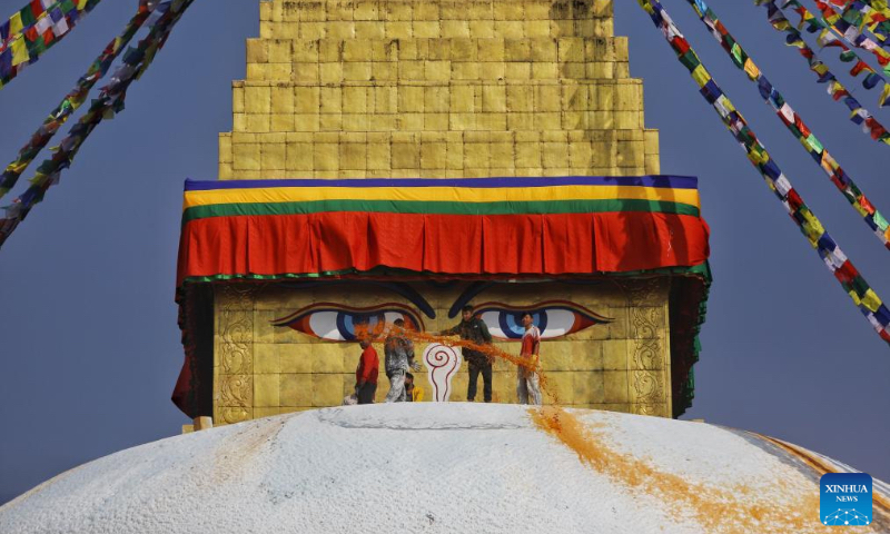 Devotees repaint the sacred stupa as part of preparations and rituals marking Buddha Jayanti at Boudhanath Stupa in Kathmandu, Nepal, May 1, 2026. Buddha Jayanti is a sacred festival commemorating the birth, attainment of enlightenment, and death of Buddha on the full moon day in the Nepali month of Baishakh each year. (Photo by Sulav Shrestha/Xinhua)