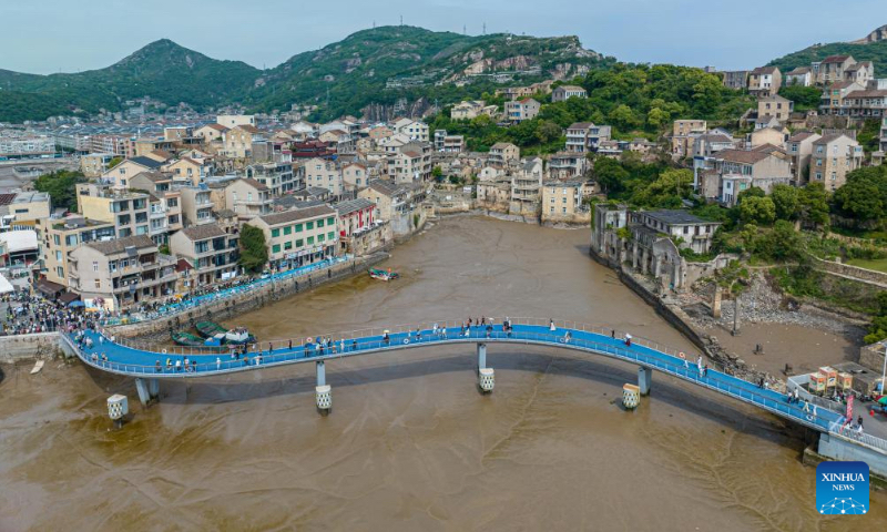 An aerial drone photo taken on May 2, 2026 shows the landscape of Liruo Village, Shitang Town, Wenling City, east China's Zhejiang Province. Shitang Town, located in Wenling City of Zhejiang Province, is a traditional fishing port surrounded by the sea on three sides. During this year's May Day holiday, the town hosted a variety of fishing culture activities, drawing tourists from across the country. (Xinhua/Jiang Han)
