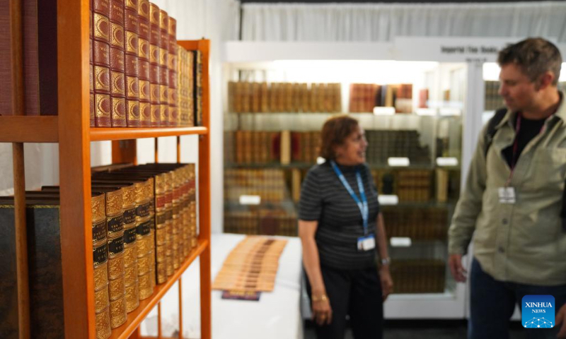 A visitor views rare books on display at the New York International Antiquarian Book Fair in New York, the United States, on April 30, 2026. The annual book fair kicked off here on Thursday, and will last until May 3. (Xinhua/Zhang Fengguo)