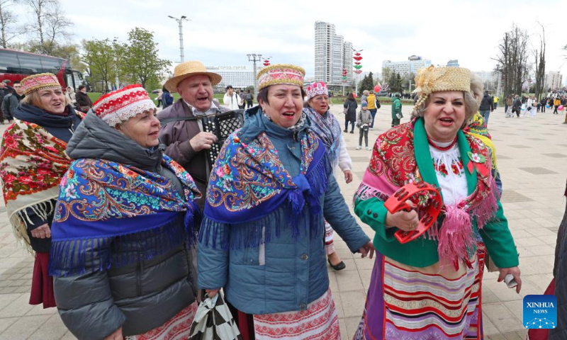 People wearing traditional costumes take part in singing and dancing activities to mark the International Labor Day in Minsk, Belarus, May 1, 2026. (Photo by Henadz Zhinkov/Xinhua)