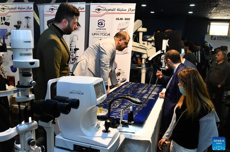 People attend an ophthalmology equipment fair in Damascus, Syria, April 23, 2026. The event brings together participants from Syria and neighboring Arab countries to showcase the latest medical technologies and developments in eye care. (Photo by Ammar Safarjalani/Xinhua)