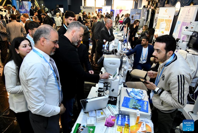 People attend an ophthalmology equipment fair in Damascus, Syria, April 23, 2026. The event brings together participants from Syria and neighboring Arab countries to showcase the latest medical technologies and developments in eye care. (Photo by Ammar Safarjalani/Xinhua)