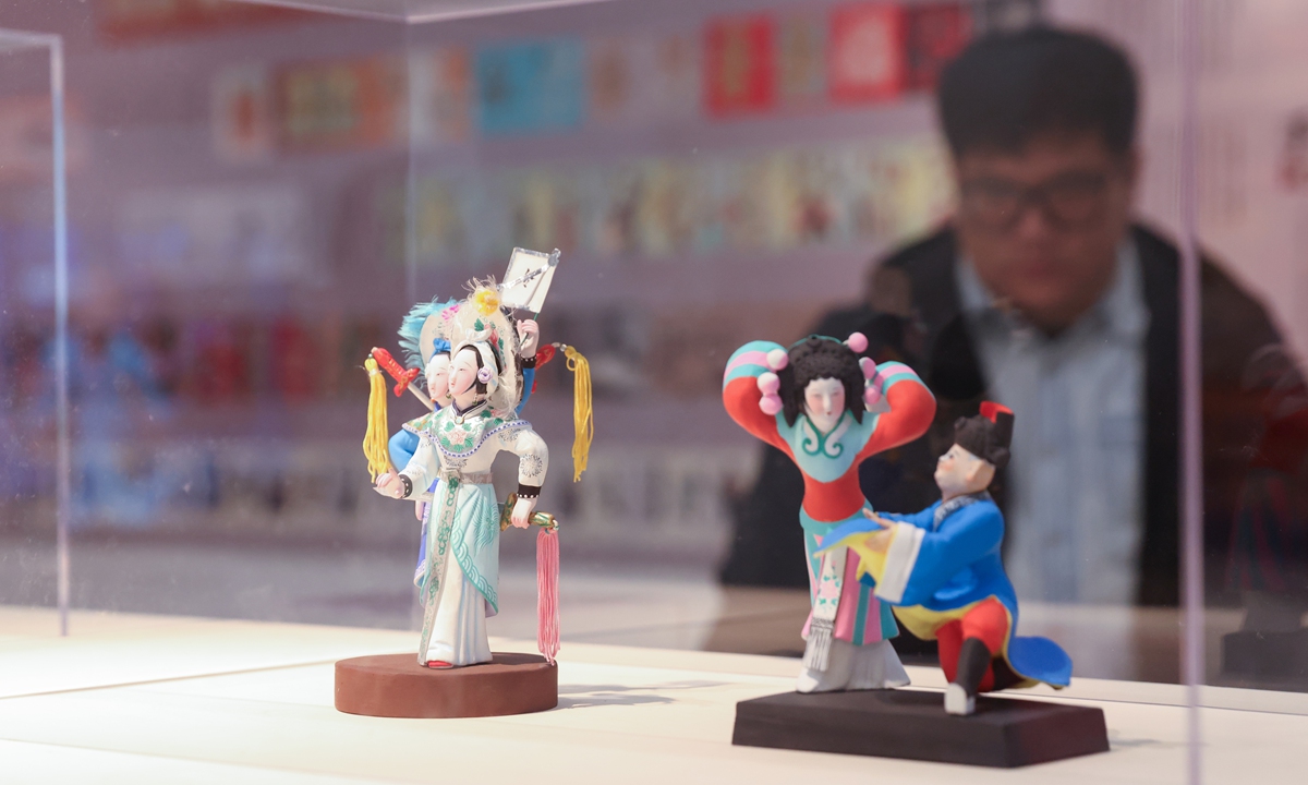 A visitor views the exhibition of Huishan clay figurines at the 5th Guardian Art Book Fair & Creative Festival in Beijing on April 22, 2026. Photo: IC