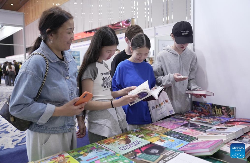 People browse books during the Eurasian Book Fair in Astana, Kazakhstan, April 22, 2026. This event is held here from April 22 to 26. (Photo by Kalizhan Ospanov/Xinhua)