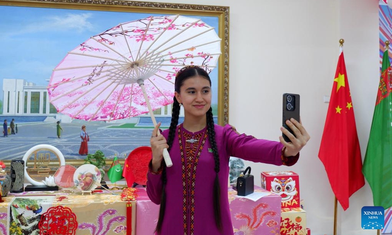 A student takes a selfie at the 2026 International Chinese Language Day event in Ashgabat, Turkmenistan, April 23, 2026. A celebration event marking the 2026 International Chinese Language Day was held here Thursday. (Photo by Cui Jiaxin/Xinhua)