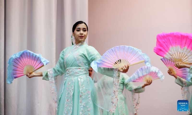 Students in costumes with traditional Chinese elements dance at the 2026 International Chinese Language Day event in Ashgabat, Turkmenistan, April 23, 2026. A celebration event marking the 2026 International Chinese Language Day was held here Thursday. (Photo by Cui Jiaxin/Xinhua)
