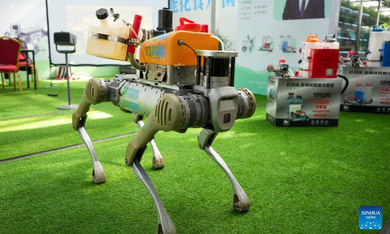 A robotic dog carrying agricultural gadgets is seen at the 27th China (Shouguang) International Vegetable Science and Technology Expo in Shouguang, east China's Shandong Province, April 20, 2026. Featuring more than 50 types of agricultural robots in its booth for digital agriculture, this year's expo allow visitors to peep into the future of unmanned farming. (Xinhua/Xu Suhui)