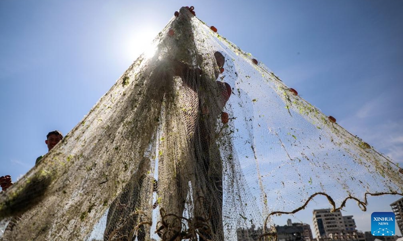 Palestinian fishermen are seen fishing on the beach in Gaza City, on April 24, 2026. (Photo by Rizek Abdeljawad/Xinhua)