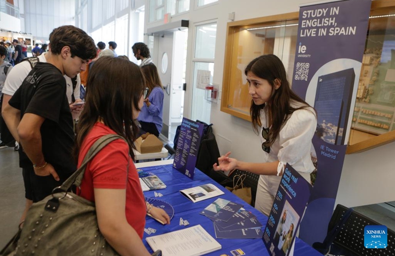 Students consult with a representative during the Global Universities Fair in Vancouver, British Columbia, Canada, April 25, 2026. Representatives from different universities and colleges from multiple countries attended the event, offering students and parents opportunities to explore international higher education options and admission pathways. (Photo by Liang Sen/Xinhua)