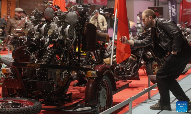 A visitor takes photos of a motorcycle during the St. Petersburg Motorcycle Exhibition in St. Petersburg, Russia, on April 24, 2026. (Photo by Irina Motina/Xinhua)