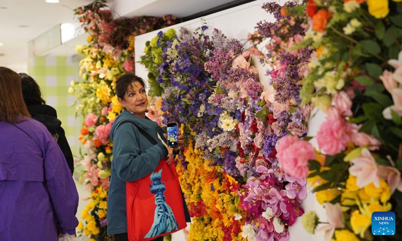 People visit the Macy's Flower Show in New York, the United States, on April 25, 2026. Featuring thousands of flowers and plants with scenic garden installations, the flower show is held here from April 23 to May 10. (Xinhua/Zhang Fengguo)