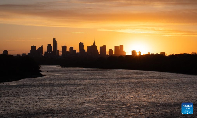 The skyline of Warsaw and the Vistula River are seen at sunset in Warsaw, Poland, April 23, 2026. (Photo by Jaap Arriens/Xinhua)