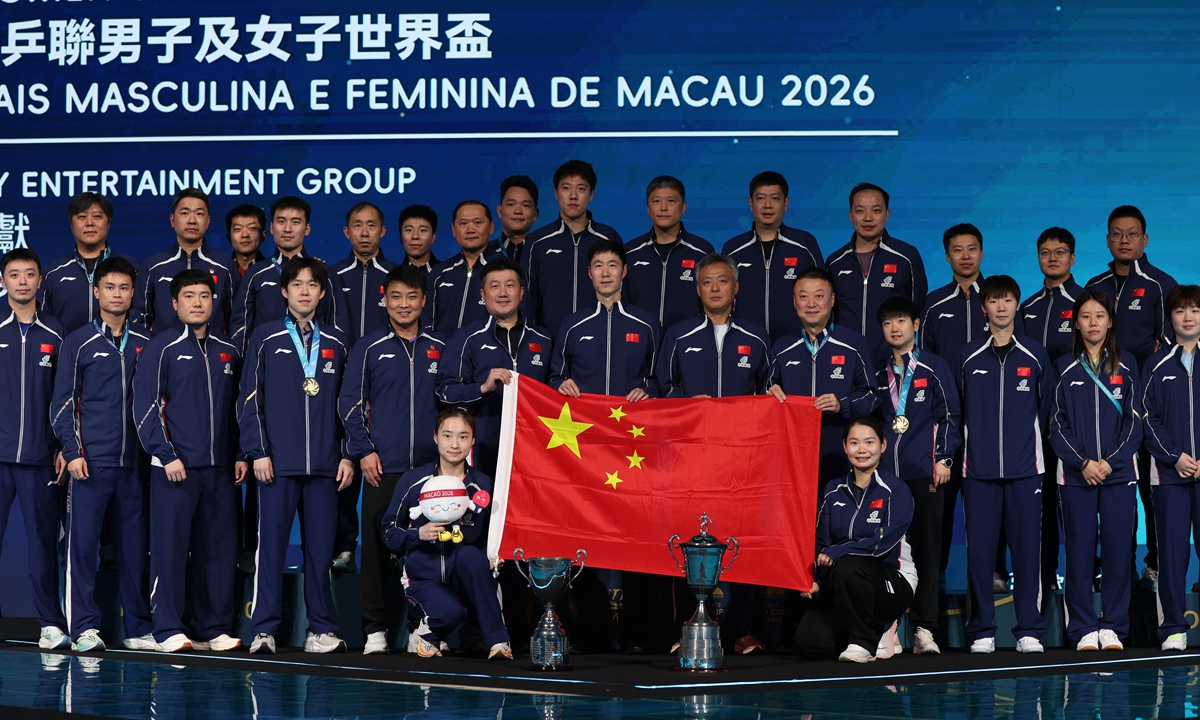 Chinese players, coaches and officials pose for a group photo after winning the table tennis World Cup in Macao on April 5, 2026. Photo: VCG