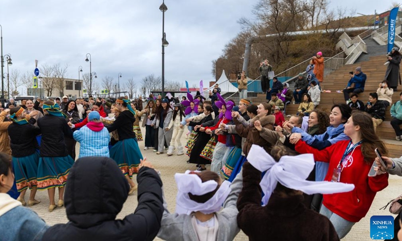 Visitors participate in the rhododendron festival in Vladivostok, Russia, April 25, 2026. The rhododendron festival was held here on Saturday to promote rhododendron-themed tourism and enhance its appeal to tourists. (Photo by Andrey Matveenko/Xinhua)