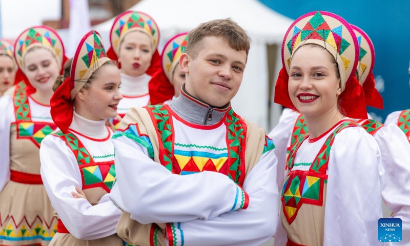 Performers are pictured during the rhododendron festival in Vladivostok, Russia on April 25, 2026. The rhododendron festival was held here on Saturday to promote rhododendron-themed tourism and enhance its appeal to tourists. (Photo by Andrey Matveenko/Xinhua)