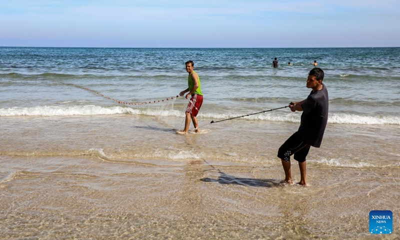 Palestinian fishermen are seen fishing on the beach in Gaza City, on April 24, 2026. (Photo by Rizek Abdeljawad/Xinhua)
