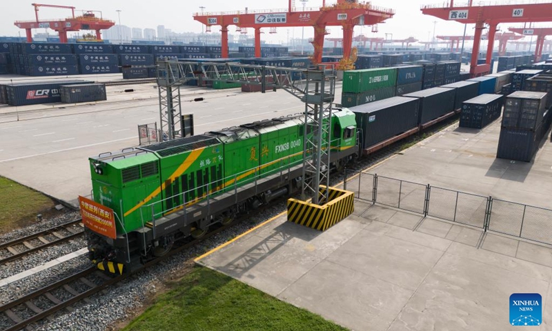 An aerial drone photo taken on April 24, 2026 shows a China-Europe freight train departing from the Xi'an International Port Station in Xi'an, northwest China's Shaanxi Province. The Xi'an International Port Station has handled over 2,000 China-Europe freight train trips this year. The total freight volume transported has exceeded 2.1 million tonnes in this period. Photo: Xinhua