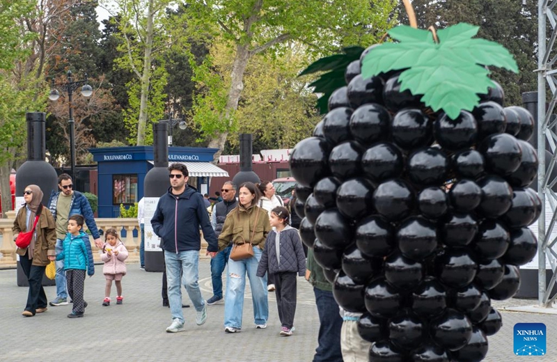 People attend the Jazz and Wine Festival at a seaside park in Baku, Azerbaijan, April 25, 2026. The ten-day event integrates Azerbaijan's indigenous wine-making traditions with musical art, bringing a relaxing and vibrant vibe to the city and drawing numerous locals and tourists for leisure and wine tasting. (Xinhua/Chen Junfeng)