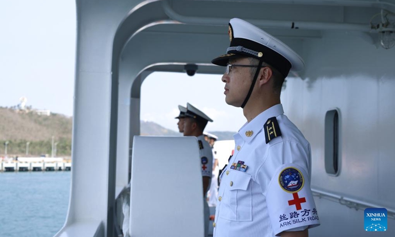Crew members of the Chinese People's Liberation Army (PLA) Navy hospital ship, Silk Road Ark, stand in formation as the ship docks at a military port in Sanya, south China's Hainan Province, April 26, 2026. (Photo by Cui Xiaoyang/Xinhua)