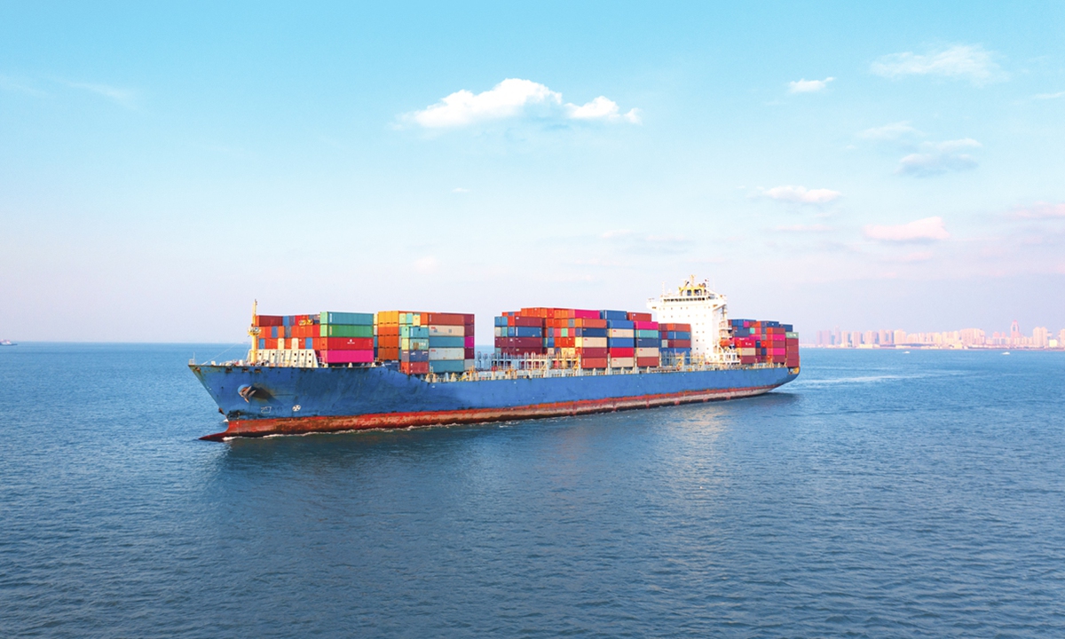 A cargo ship sails near Qingdao Port in East China's Shandong Province. Photo: VCG