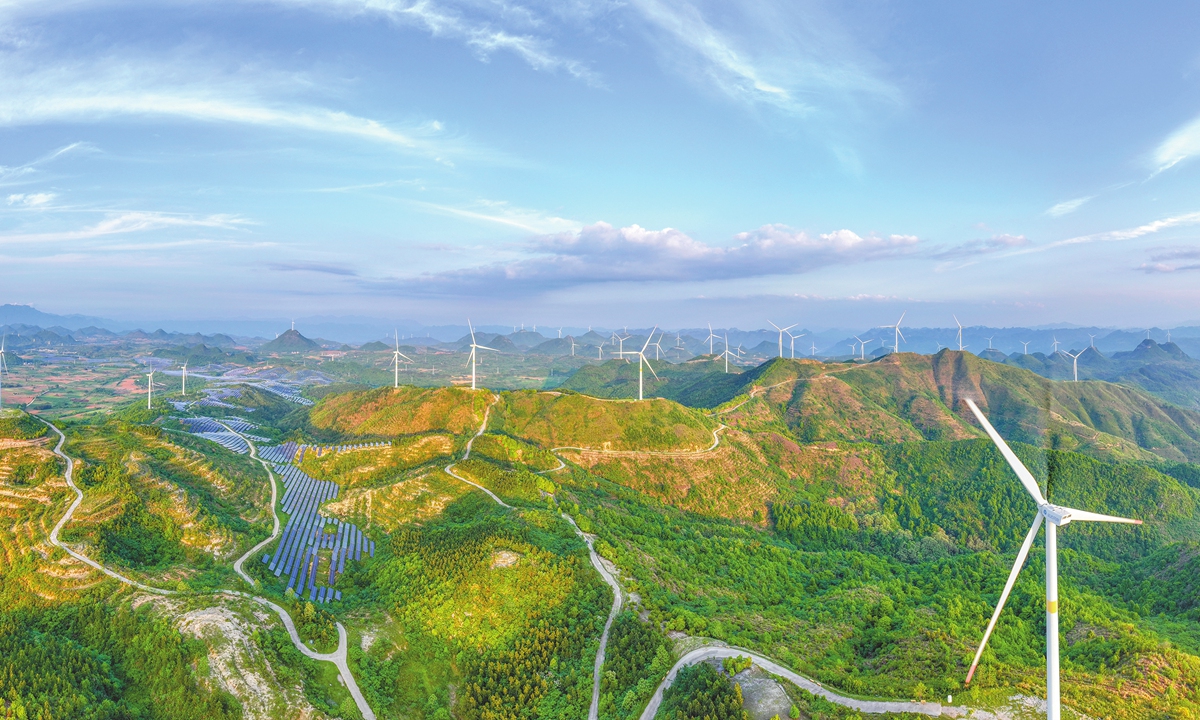 Wind turbines and solar panels work together on the heights of Bajie Mountain in Yangshan, South China's Guangdong Province, on April 19, 2026. Photo VCG