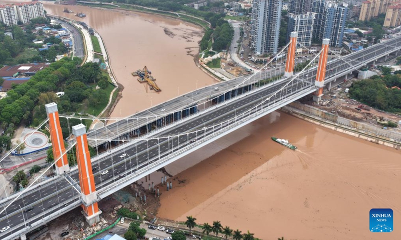 An aerial drone photo taken on April 28, 2026 shows the Zicai bridge of Pinglu Canal in Qinzhou, south China's Guangxi Zhuang Autonomous Region. The Zicai bridge, a key project across the Pinglu Canal, officially opened to traffic on Tuesday. It is the newest of all 27 planned bridges spanning the Pinglu Canal. (Xinhua/Zhou Hua)


