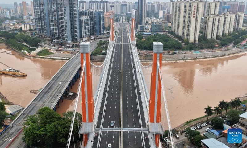 An aerial drone photo taken on April 28, 2026 shows the Zicai bridge of Pinglu Canal in Qinzhou, south China's Guangxi Zhuang Autonomous Region. The Zicai bridge, a key project across the Pinglu Canal, officially opened to traffic on Tuesday. It is the newest of all 27 planned bridges spanning the Pinglu Canal. (Xinhua/Zhou Hua)

