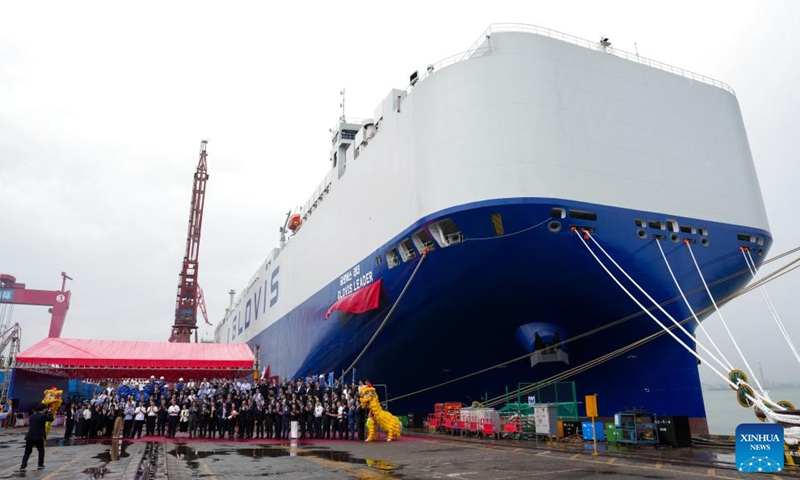 Guests pose for a group photo at the delivery ceremony of car carrier Glovis Leader in Guangzhou, south China's Guangdong Province, April 28, 2026. A car carrier with a maximum capacity of 10,800 car equivalent units, described as the world's largest of its kind, was delivered Tuesday in the southern Chinese city of Guangzhou. The vessel, named Glovis Leader, was built by Guangzhou Shipyard International Company Limited under the China State Shipbuilding Corporation (CSSC), together with China Shipbuilding Trading Co., Ltd.  (Xinhua/Wu Lu)

