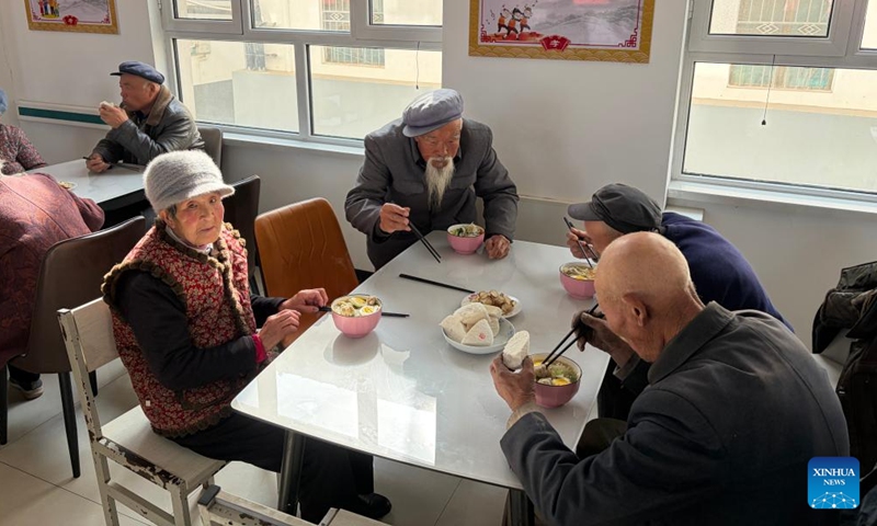 Senior residents have meals at an elderly service center in Shanhai Xincun Community in Chankou Town of Dingxi City, northwest China's Gansu Province, Feb. 3, 2026. (Xinhua/Cheng Nan)

