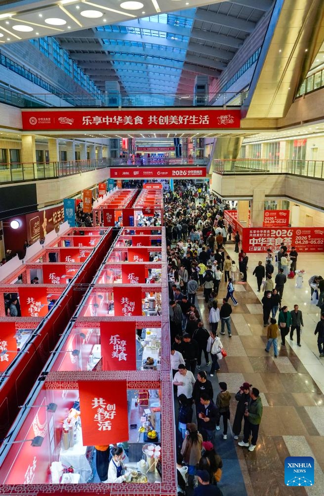 Consumers enjoy food during a Chinese cuisine carnival in Yinchuan, northwest China's Ningxia Hui Autonomous Region, on April 28, 2026. (Xinhua/Yang Zhisen)

