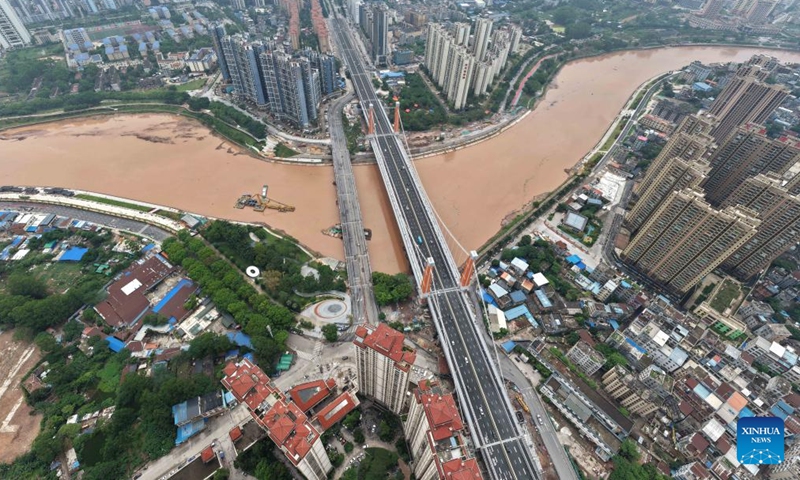 An aerial drone photo taken on April 28, 2026 shows the Zicai bridge of Pinglu Canal in Qinzhou, south China's Guangxi Zhuang Autonomous Region. The Zicai bridge, a key project across the Pinglu Canal, officially opened to traffic on Tuesday. It is the newest of all 27 planned bridges spanning the Pinglu Canal. (Xinhua/Zhou Hua)

