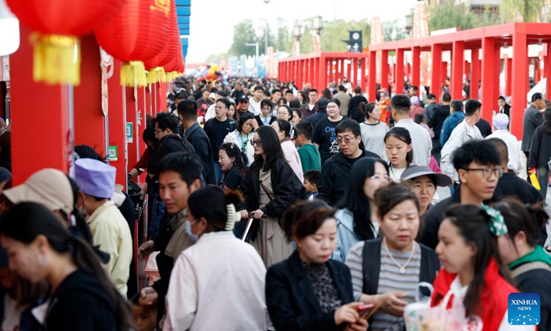 Consumers visit a food fair during a Chinese cuisine carnival in Wuzhong, northwest China's Ningxia Hui Autonomous Region, on April 28, 2026. (Xinhua/Wang Peng)


