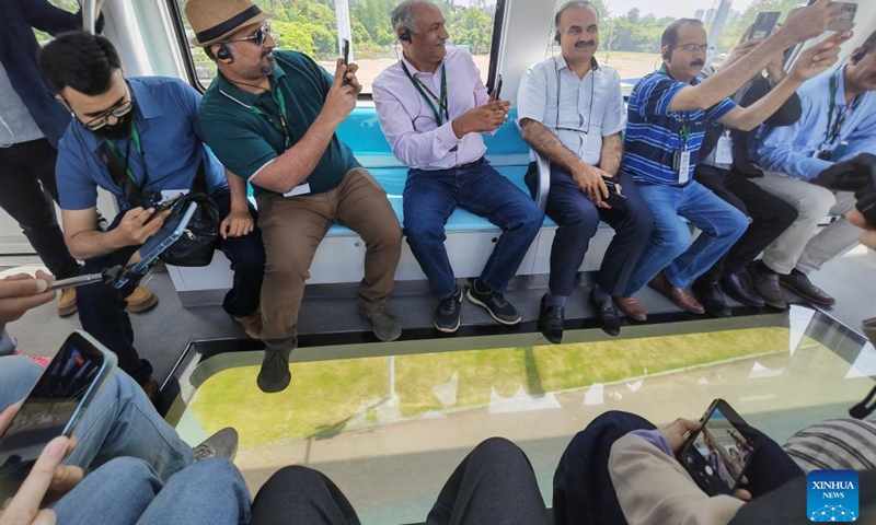 Pakistani delegates experience sky rail service in Wuhan, central China's Hubei Province, April 25, 2026. (Xinhua/Yue Wenwan)

