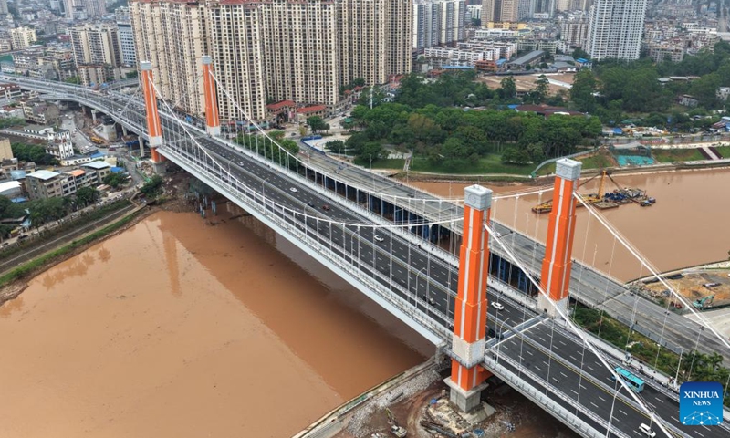 An aerial drone photo taken on April 28, 2026 shows the Zicai bridge of Pinglu Canal in Qinzhou, south China's Guangxi Zhuang Autonomous Region. The Zicai bridge, a key project across the Pinglu Canal, officially opened to traffic on Tuesday. It is the newest of all 27 planned bridges spanning the Pinglu Canal. (Xinhua/Zhou Hua)

