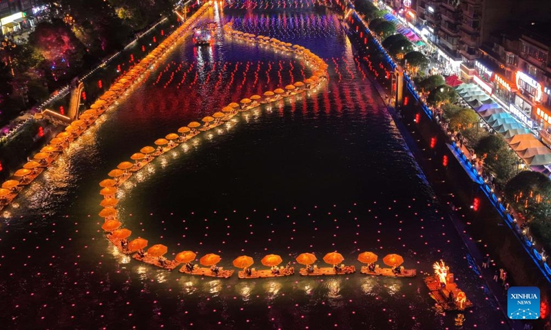 A drone photo taken on May 2, 2026 shows tourists taking bamboo rafts in Xuanen County of Enshi Tujia and Miao Autonomous Prefecture, central China's Hubei Province.(Photo by Song Wen/Xinhua)