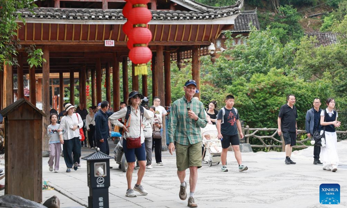 Foreign tourists visit Zhaoxing Dong Village of Liping County, southwest China's Guizhou Province, May 2, 2026.
China's inbound tourism booms thanks to visa exemption policies. (Photo by Liang Huibo/Xinhua)